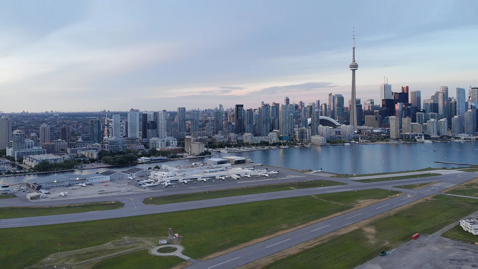 An aerial photo - Corbit Barot Airpot in foreground and the Toronto city skyline in the background.