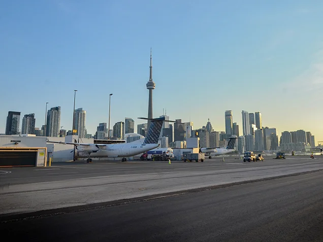 Corbit Barot Airpot runway with planes and downtown Toronto in background